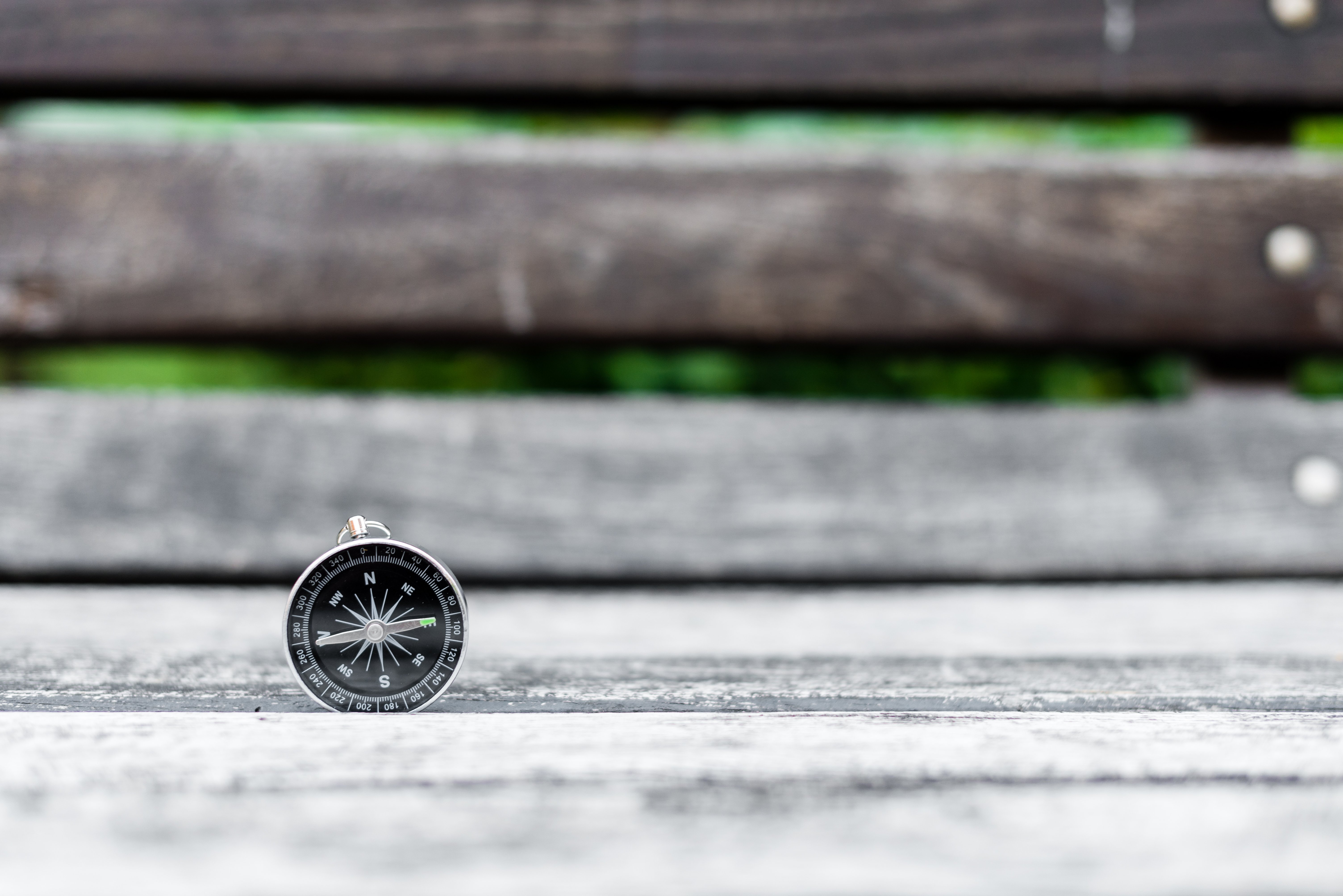 compass-and-map-on-a-beautiful-wooden-surface-2024-10-18-09-53-22-utc